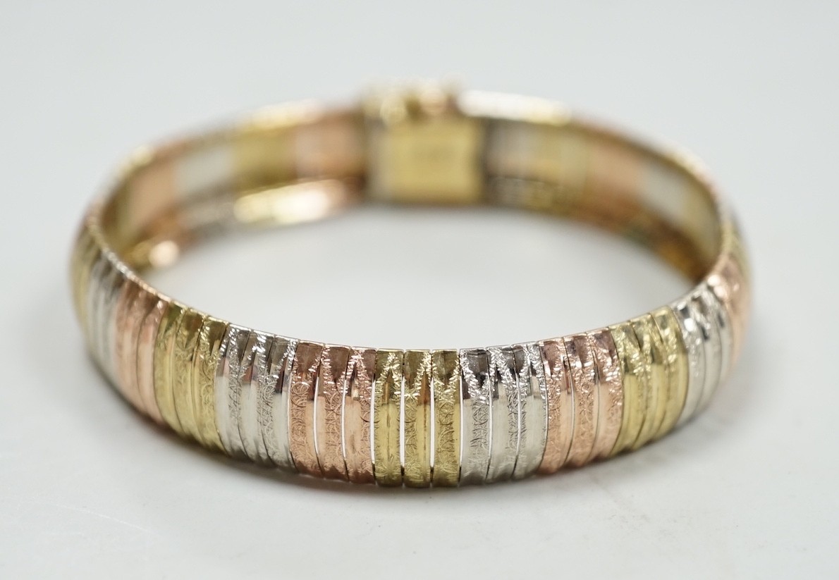 A modern Italian three colour 9ct gold bracelet, 18cm, 18 grams.